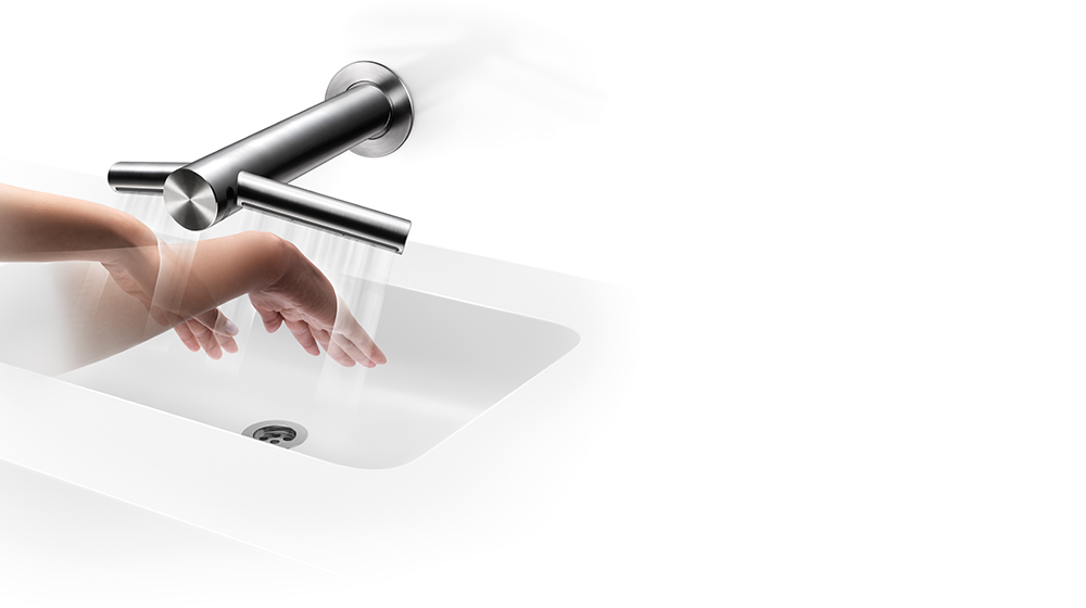 Model suši ruke pod sušilom za ruke Dyson Airblade Wash+Dry.