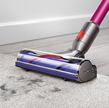 V8 Absolute cord-free vacuu cleaning floors with soft roller cleaner head