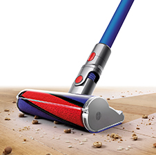 V8 Absolute cord-free vacuu cleaning floors with soft roller cleaner head